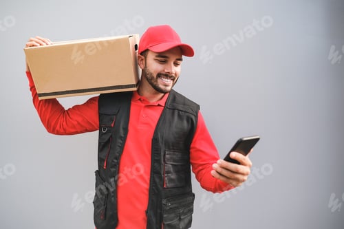 Preview: Young delivery man checking adress of costumer with scanner
