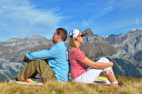 Preview: Young Couple Enjoying Alpine Panorama. Switzerland