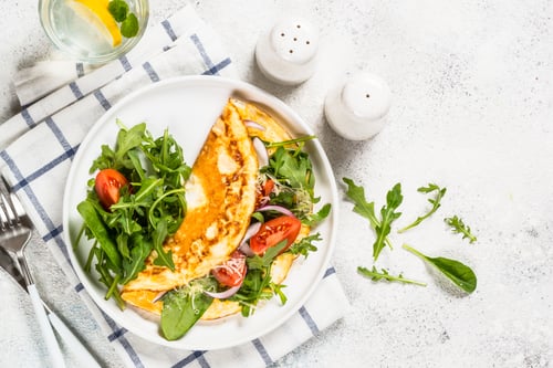 Preview: Omelette with green leaves top view