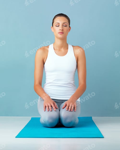 Preview: Studio shot of a healthy young woman posing against a blue background