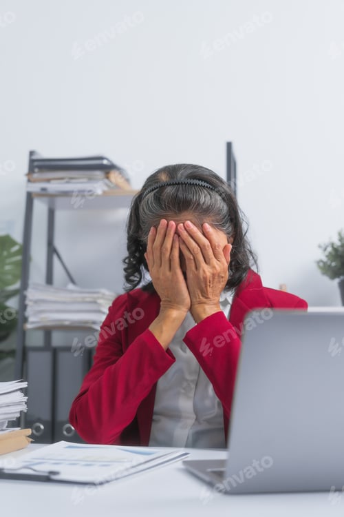 Preview: Confident Asian elderly old businesswoman tired stressed suffering from headache at work with laptop