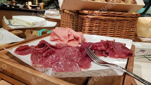 Preview: Arrangement of Meats with Cheese and Bread Basket