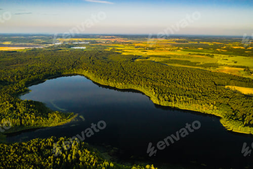 Preview: Top view of Bolta lake in the forest in the Braslav lakes National Park at dawn, the most beautiful