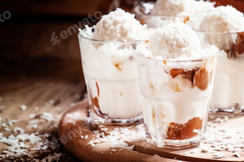 Preview: Coconut dessert with vanilla ice cream and caramel, selective focus