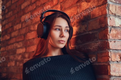 Preview: A beautiful charming brunette in a room with loft interior.