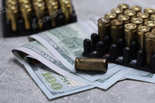 Preview: Cartridges and dollars on grey table, closeup