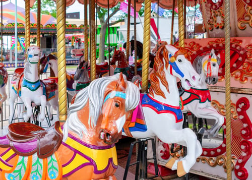 Preview: Colorful carousel horses at a traveling carnival