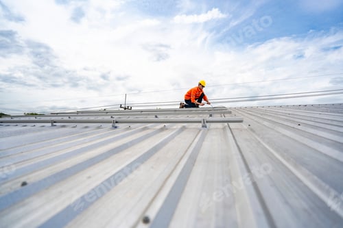 Preview: A skilled technician adjusts a solar panel on rooftop