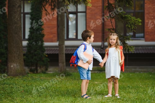 Preview: Happy children go back to school. Pupil of primary school go study with backpack outdoors.