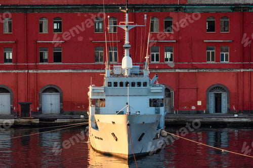 Preview: Navy Warship at a port with Historic Downtown City on Mediterranean Coast of Naples, Italy.