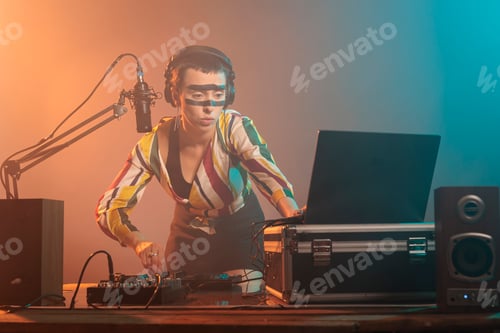Preview: Focused artist playing melody at dj turntables
