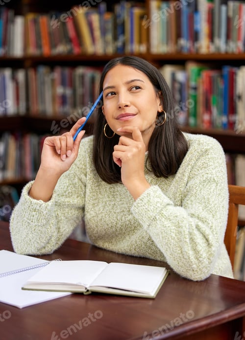 Preview: Shot of a young woman studying in a college library