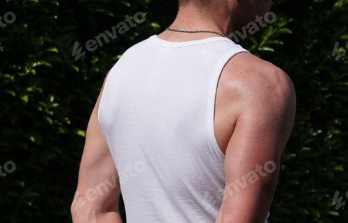 Preview: Back shot of an athletic man in sleeveless white t-shirt