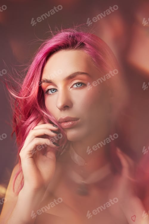 Preview: Art beauty portrait of a woman with pink hair, creative coloring. Bright colored highlights and