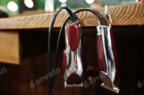 Preview: Barber tools on wooden background table with electric machines.