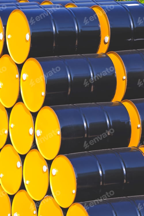 Preview: Group of black and yellow 200 liter chemical barrels stacked in vertical frame