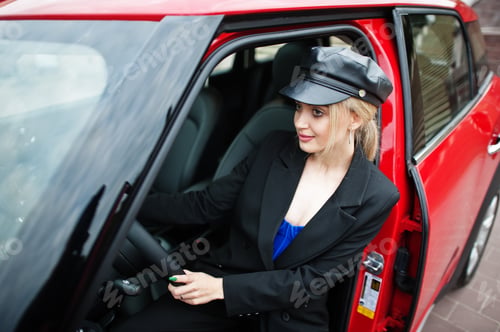Preview: Portrait of beautiful blonde sexy fashion woman model in cap