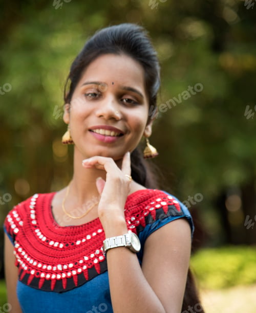 Preview: Outdoor portrait of beautiful young Indian girl in the park