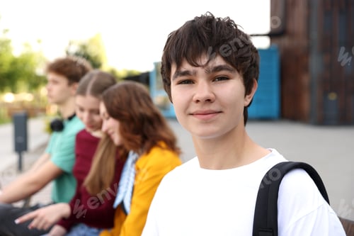 Preview: Teenagers spending time together outdoors, selective focus