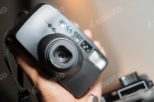 Preview: Close-Up of a Vintage Camera in Hand
