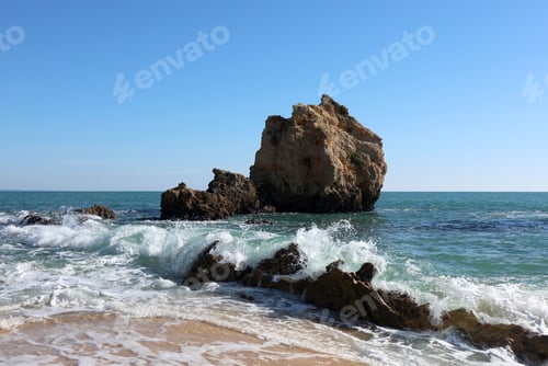 Preview: Ocean waves and rocky cliffs in Algarve, Portugal.