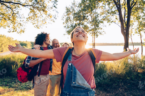 Preview: Happy woman enjoying nature with friends