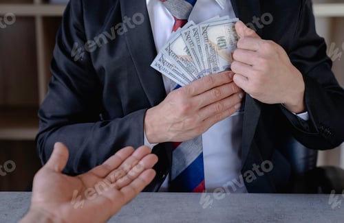 Preview: businessman or corrupt politician is offering bribes that are given in the form of dollar cash To do
