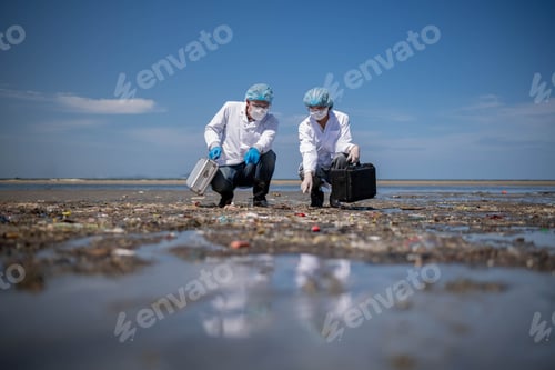 Preview: Scientist analyst wearing protective form, glove, magnifying glass and box under working water analy