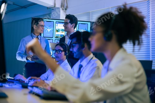 Preview: Diverse professional team with headsets working in a modern office.