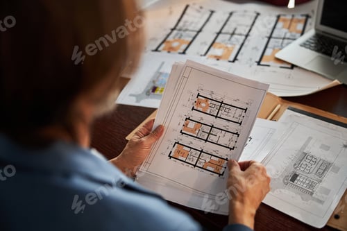 Preview: Fragment photo of skilled businessman looking at paperwork