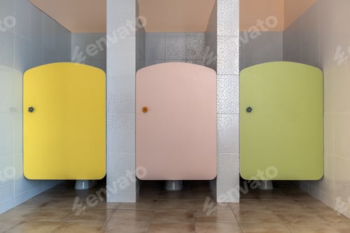 Preview: Colorful toilet doors in elementary school bathroom interior