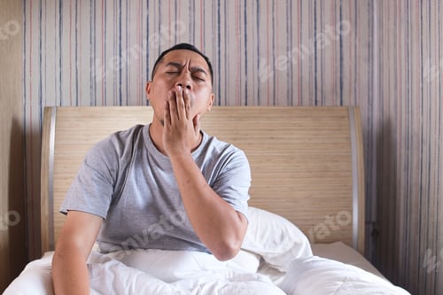 Preview: an yawning after woke up sitting on bed