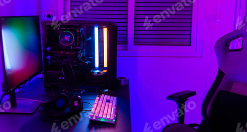 Preview: A computer setup with a purple light dark background, games transmission modern equipment, modern