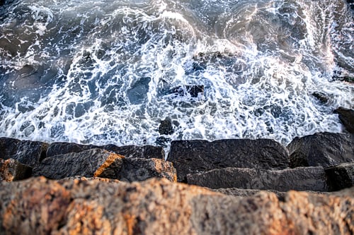 Preview: Beautiful sea at sunset near the rocky shore