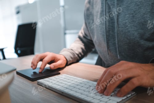 Preview: Man working on computer