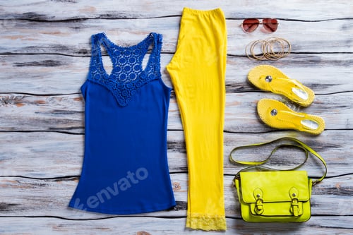 Preview: Blue tank top and trousers.