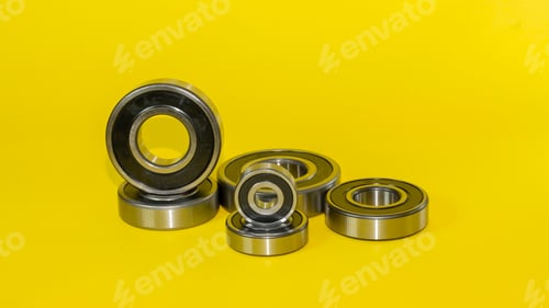 Preview: Closeup shot of ball bearings isolated on a yellow background