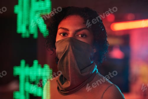 Preview: Pretty girl with mask standing in cafe with green hieroglyphs meaning best ramen