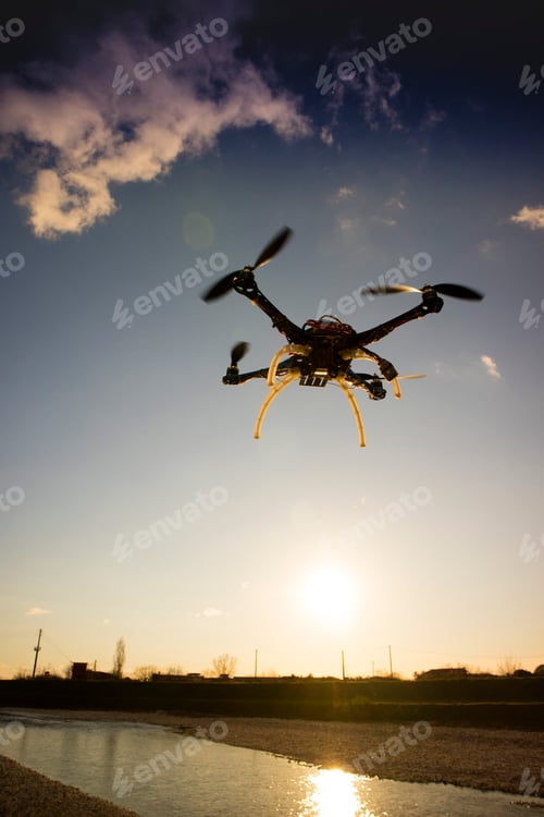 Preview: Quadrocopter in flight at sunset