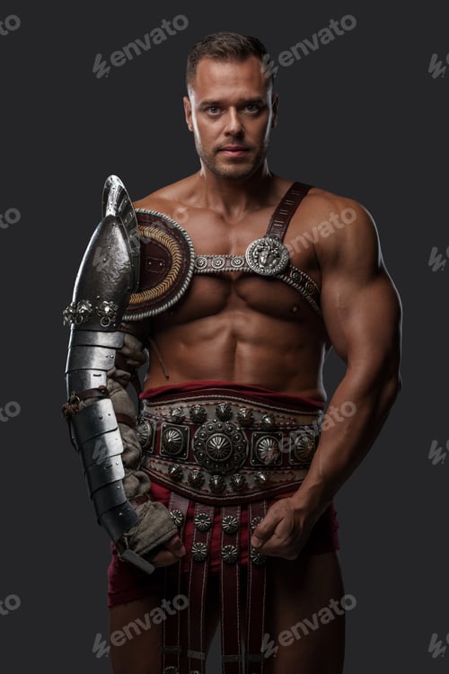 Preview: Muscular gladiator with naked torso staring at camera
