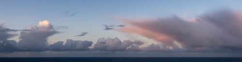Preview: Dramatic Panoramic View of a cloudscape during a dark, rainy and colorful sunrise