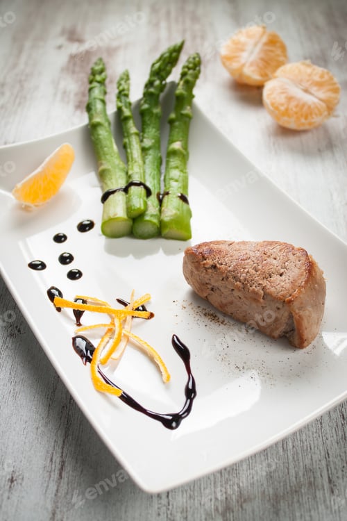 Preview: Elegant Plate of Asparagus and Meat