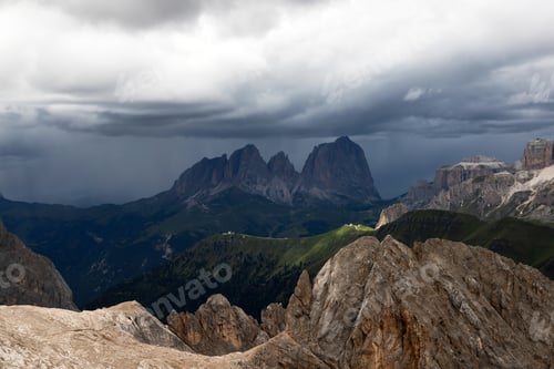 Preview: The three peaks of the Sassolungo (Langkofel) befor summer storm in the Dolomites, Italy.