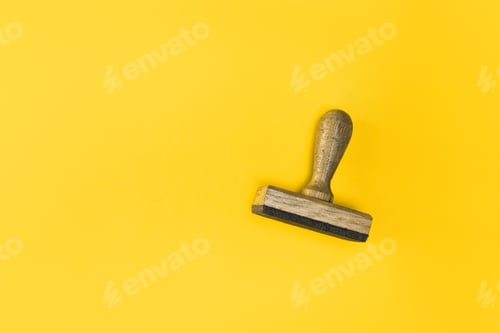 Preview: top view of stamp isolated on yellow, quality guarantee concept