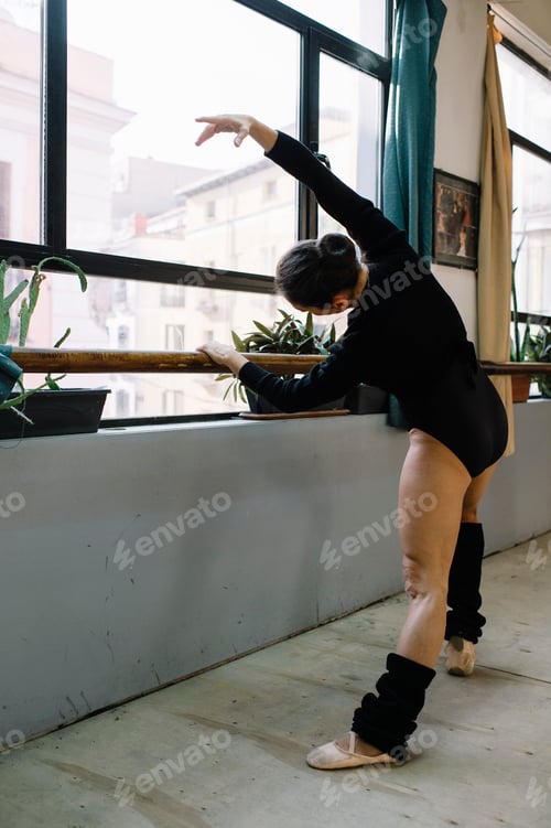 Preview: Ballet dancer practicing indoors.