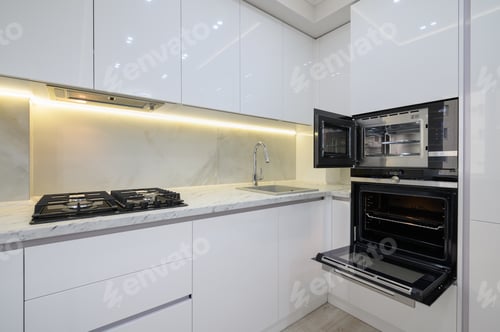 Preview: White modern kitchen with a stove, oven and microwave