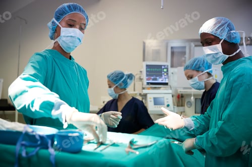 Preview: Surgical Team Working On Patient In Hospital Operating Theatre