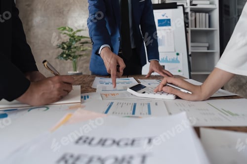 Preview: Business team using a calculator to calculate the numbers of statistic business profits growth rate