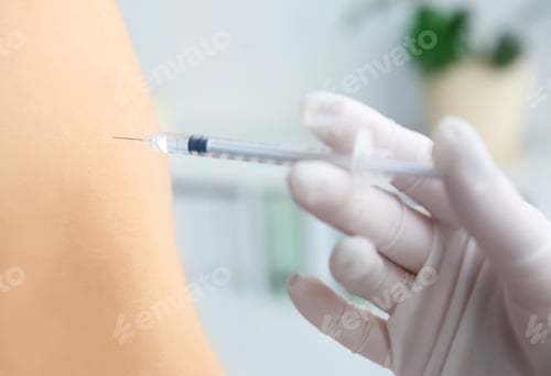 Preview: Doctor vaccinating male patient in clinic, closeup