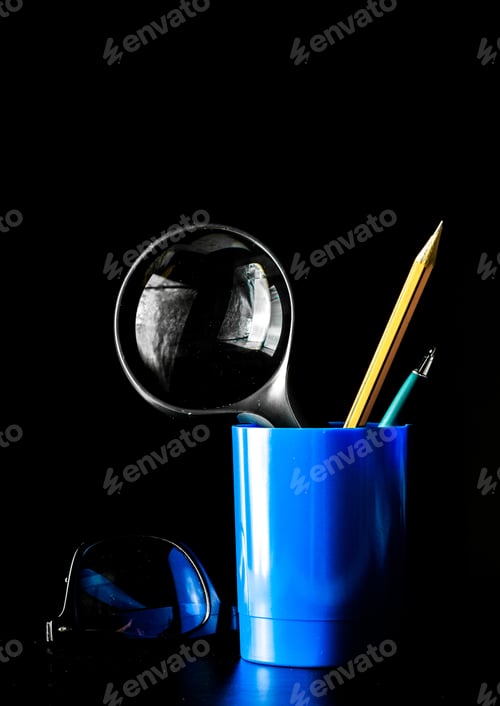Preview: Closeup of magnifying glass on dark surface